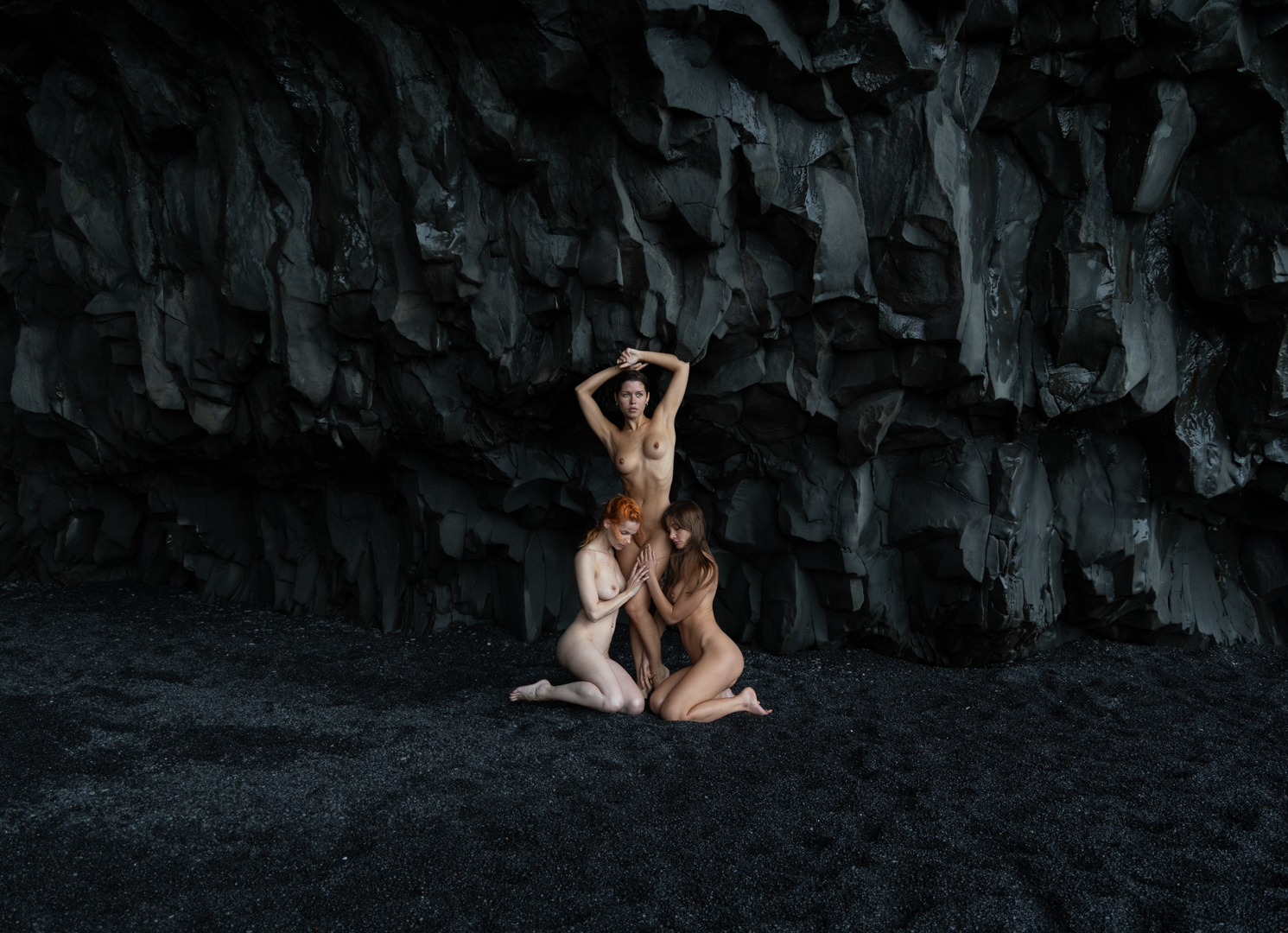 Figures in a dark Icelandic cave